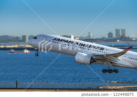 Jet passenger plane taking off from Haneda Airport 122449875