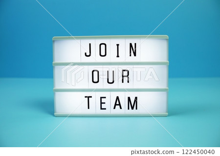 Join Our Team letterboard text on LED Lightbox on blue background 122450040