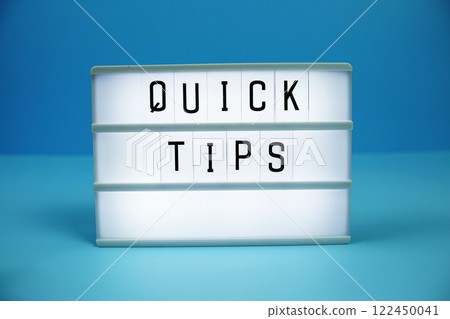 Quick Tips letterboard text on LED Lightbox on blue background Quick Tips letterboard text on LED Lightbox on blue background 122450041