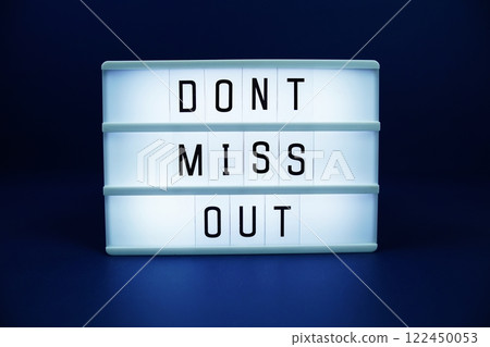 Don't miss out letterboard text on LED Lightbox on blue background 122450053