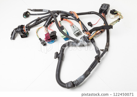 A cable of matted wires of different colors with connectors in the electrical wiring of the car. Internet line in the work of the provider. A cable of matted wires of different colors with connectors in the electrical wiring of the car. Internet line in the work of the provider. 122450071