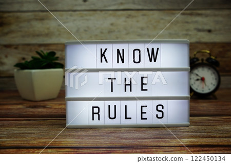KNOW THE RULES letterboard text on LED Lightbox on wooden background, Business and Communication concept background 122450134