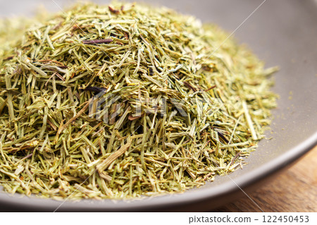Healing Horsetail dried leaves in a bowl. Natural medicinal herbal tea ingredient.  122450453