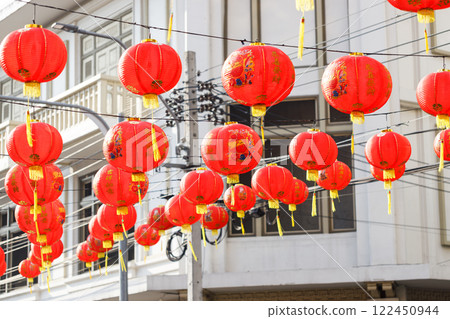 Spring festival, Lunar or Chinese new year lanterns decorated over street in old town, Thailand. The letters mean Luck, Congratulations, Blessing and Happiness 122450944
