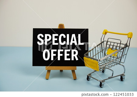 Special Offer text message and trolley shopping cart on blue background 122451033