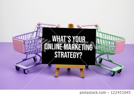What's your online marketing strategy? text message and trolley shopping cart on purple background What's your online marketing strategy? text message and trolley shopping cart on purple background 122451045
