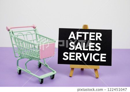 After Sales Service text message and trolley shopping cart on purple background 122451047