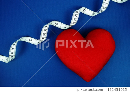 Red Heart with white measure tape on navy blue background, Healthy concept 122451915