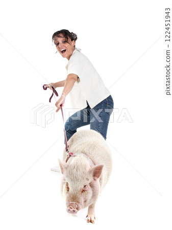 miniature pig and woman in studio 122451943