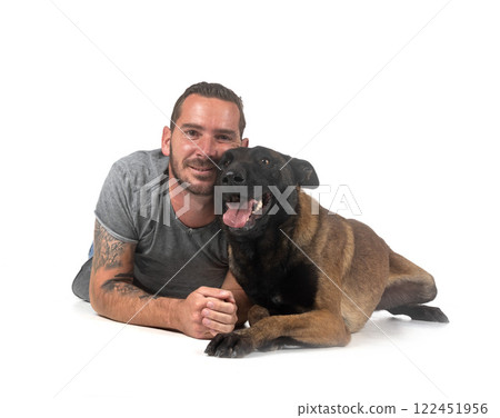 malinois and owner in studio 122451956