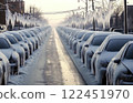 Frozen cars and power lines creating a surreal winter landscape 122451970
