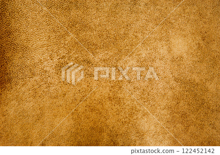 Light brown color suede background. Mustard color, suede leather macro photo, material for designer 122452142