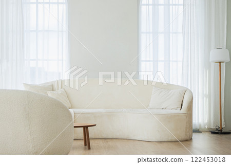 Stylish loft bedroom interior. Spacious design apartment with light walls large windows white couch sofa and armchair. Clean modern decoration with elegant furniture in minimalist Scandinavian style Stylish loft bedroom interior. Spacious design apartment with light walls large windows white couch sofa and armchair. Clean modern decoration with elegant furniture in minimalist Scandinavian style 122453018