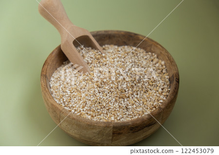 Raw fine ground barley porridge Gluten free cereals. Health gut benefits. Concept of alternative whole spelt grain ingredient. Vegetarian diet recipes. Plant-based lifestyle. Copy space Protein rich 122453079