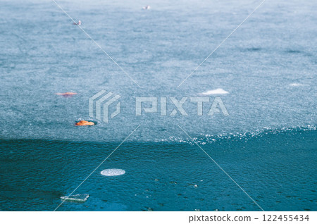 Frozen lake surface in winter 122455434