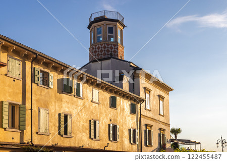 Old house with lighthouse in Lazise town on shore of Lake Garda. at sunset, Italy, Europe. Old house with lighthouse in Lazise town on shore of Lake Garda. at sunset, Italy, Europe. 122455487