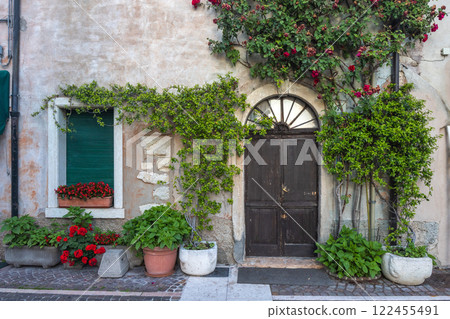 Facade of an old house in Lazise town on shore of Lake Garda, Italy, Europe. Facade of an old house in Lazise town on shore of Lake Garda, Italy, Europe. 122455491