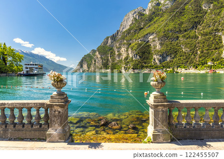 Lake Garda with mountains in background, view from Riva del Garda town shore, Italy, Europe. Lake Garda with mountains in background, view from Riva del Garda town shore, Italy, Europe. 122455507