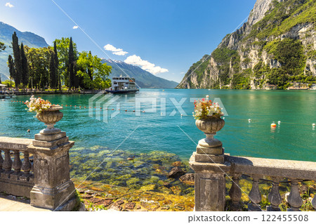 Lake Garda with mountains in background, view from Riva del Garda town shore, Italy, Europe. 122455508
