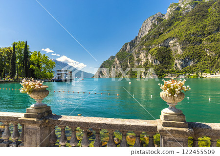 Lake Garda with mountains in background, view from Riva del Garda town shore, Italy, Europe. 122455509