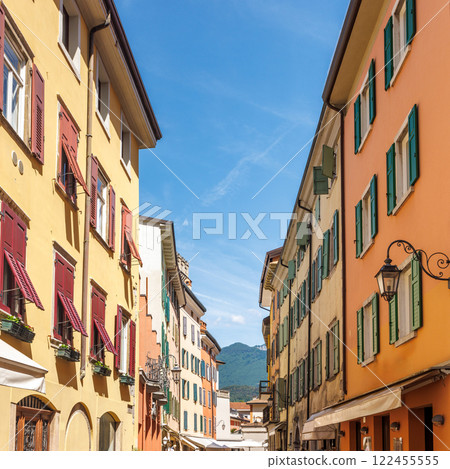 Colorfull buildings in a street of the Riva del Garda, town on the shores of Lake Garda, Italy, Europe. Colorfull buildings in a street of the Riva del Garda, town on the shores of Lake Garda, Italy, Europe. 122455555