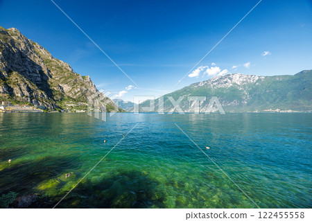 Lake Garda with mountains in background, view from Limone Sul Garda town, Italy, Europe. 122455558