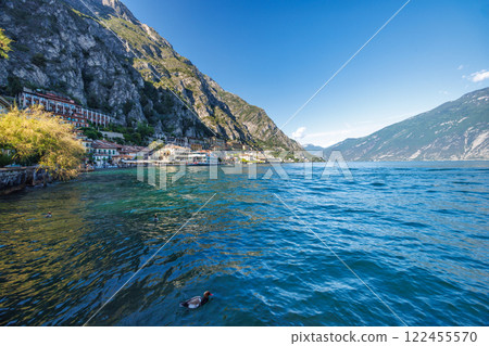 Lake Garda with mountains in background, view from Limone Sul Garda town, Italy, Europe. 122455570