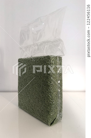 Vacuum transparent plastic bag with tofu litter pellets in green palette. Flushable Clumping Fast Drying Tofu Cat Ultra Absorbent Litter Pack. Premium eco litter, soluble in water. Vacuum transparent plastic bag with tofu litter pellets in green palette. Flushable Clumping Fast Drying Tofu Cat Ultra Absorbent Litter Pack. Premium eco litter, soluble in water. 122456116