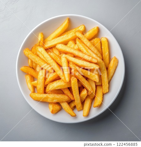 Crispy golden French fries served in a white bowl. isolated on white background. 122456885