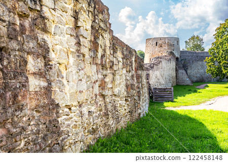 Ancient weathered rough stone walls and tower of the Izborsk fortress, Izborsk, Russia. Medieval castle of the 14th century 122458148