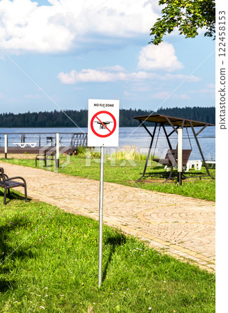 No fly zone sign on the territory of a private area in summer. Drone flight not allowed No fly zone sign on the territory of a private area in summer. Drone flight not allowed 122458153