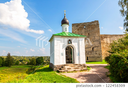 Orthodox Chapel of the Korsunskaya Icon of the Mother of God and Talav Tower of the medieval Izborsk fortress in summer, Izborsk, Pskov region, Russia Orthodox Chapel of the Korsunskaya Icon of the Mother of God and Talav Tower of the medieval Izborsk fortress in summer, Izborsk, Pskov region, Russia 122458309