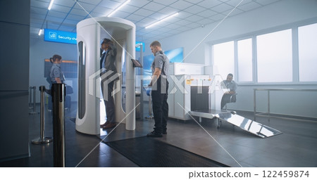 Airport Terminal: Mature Businessman Walks Through Metal Detector Scanner Gates Airport Terminal: Mature Businessman Walks Through Metal Detector Scanner Gates 122459874