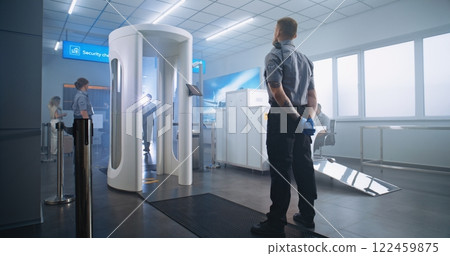 Airport Terminal: Mature Businessman Walks Through Metal Detector Scanner Gates 122459875