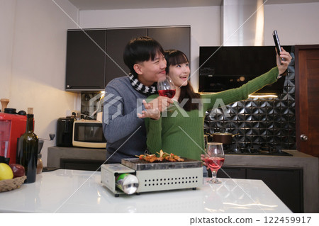 Young Asian couple living at home Young Asian couple living at home 122459917