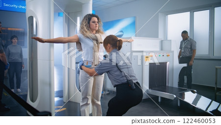 Female Security Officer Inspects Passenger, Documents, Ticket for Plane Flight 122460053