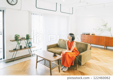 Living room interior young woman 122460062