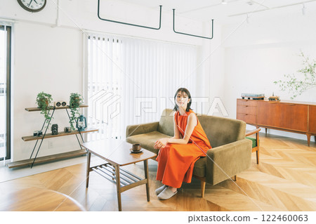 Living room interior young woman Living room interior young woman 122460063