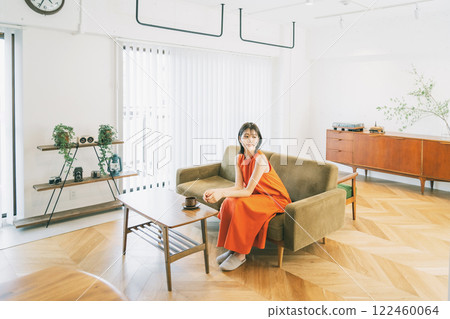 Living room interior young woman 122460064
