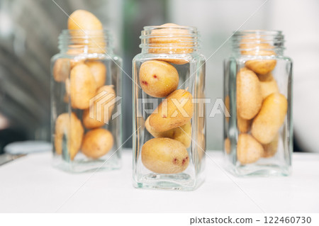 mini potato tubers in glass jars mini potato tubers in glass jars 122460730