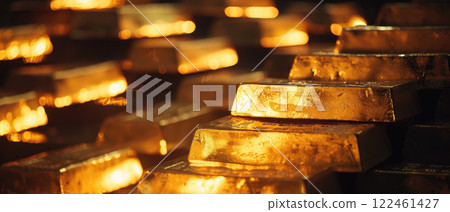 Gold bars close-up, shiny golden ingots in vault, much money bricks in dark room. Concept of luxury blocks, wealth, finance, bullion, background 122461427
