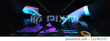 Business professionals collaborating over interactive digital table with global financial data, charts, and futuristic blue interface against dark background. 122461551
