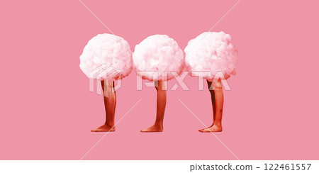Minimalistic absurd collage. legs emerge from rise balls against pink background, symbolizing light collaboration. 122461557