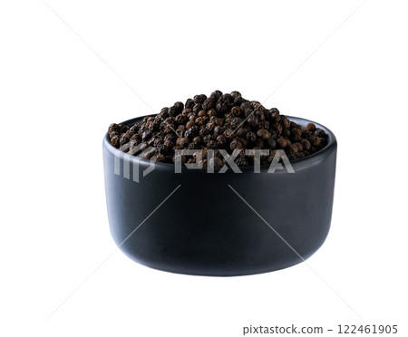 black ceramic bowl with black peppercorns isolated on white background. black ceramic bowl with black peppercorns isolated on white background. 122461905