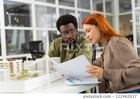 Two young architects working together on a new sustainable project Two young architects working together on a new sustainable project 122462017