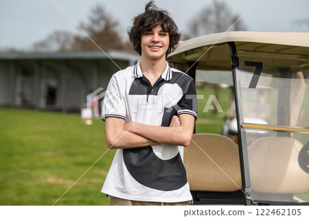 Young guy standing on a golf field and looking confident 122462105