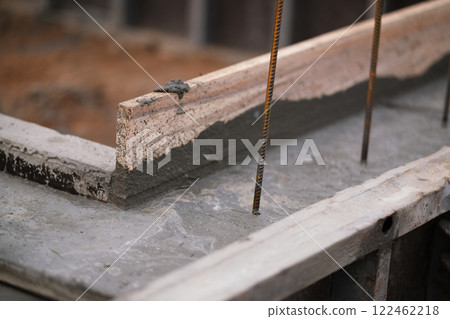 Construction of pile-grillage foundation. Monolithic foundation with metal reinforcement. Monolithic concrete foundation. House construction 122462218