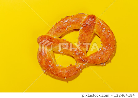 Pretzel scattered across a bright yellow background Pretzel scattered across a bright yellow background 122464194