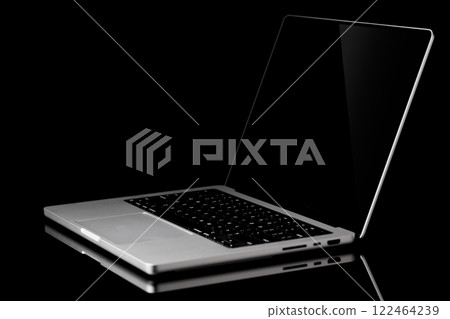 Laptop with a blank screen isolated on a black background Laptop with a blank screen isolated on a black background 122464239