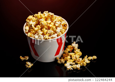 A box of fluffy popcorn against a black background 122464244